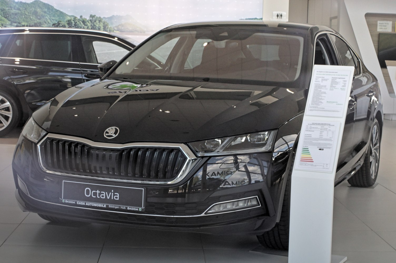Front view with prominent grille and sharp headlights