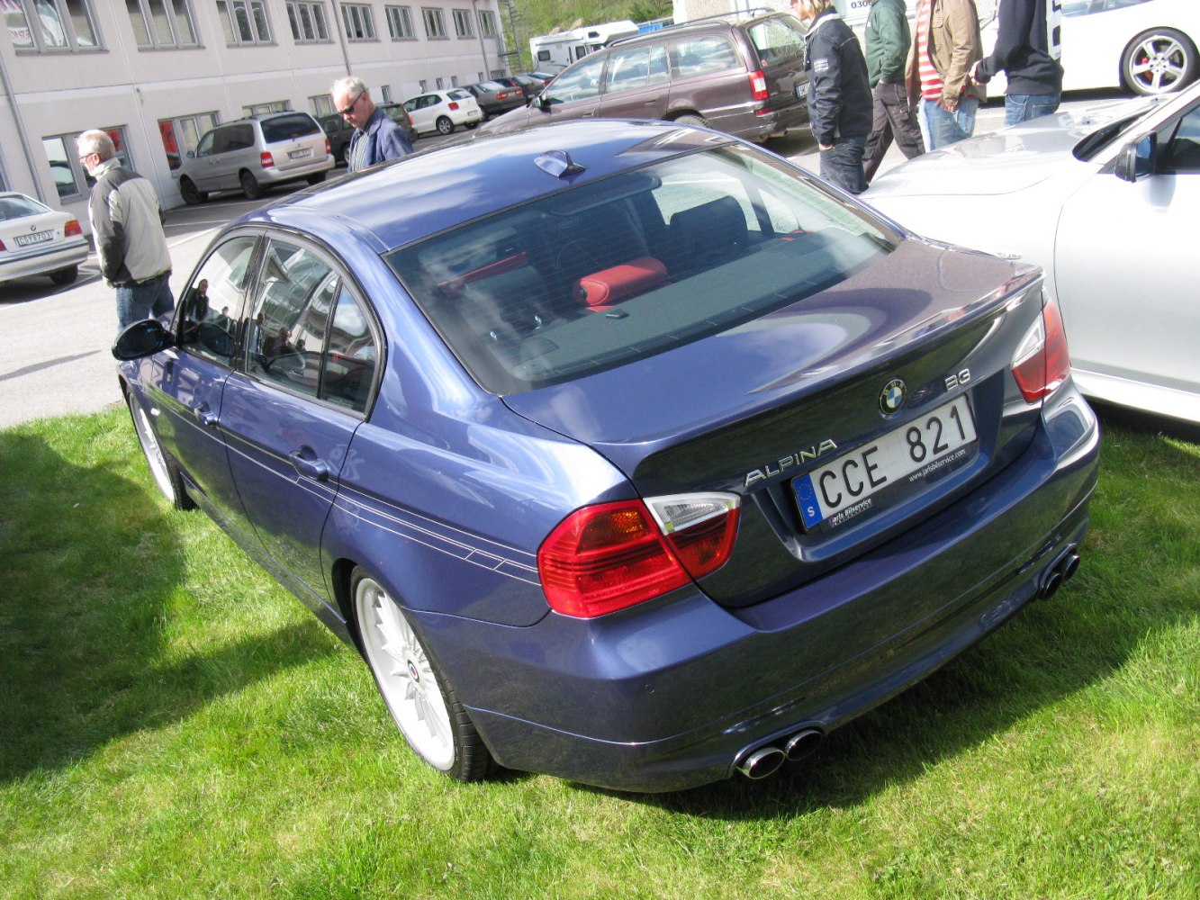 Blue sedan rear with quad exhaust and Alpina badge
