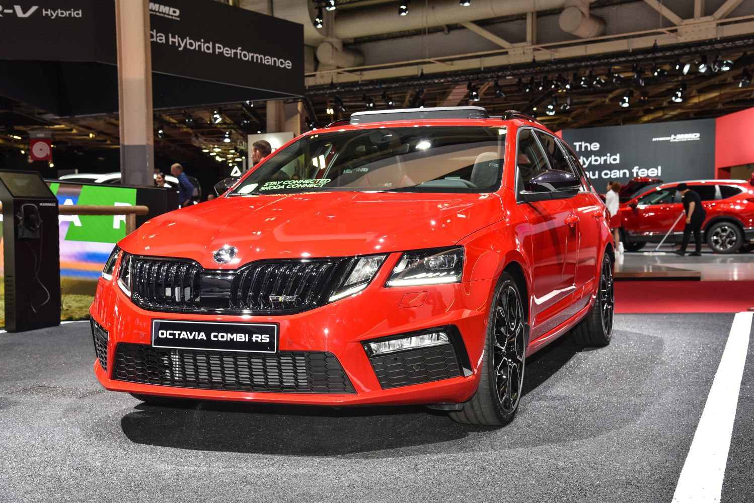 Aggressive front grille and LED headlights on sporty red wagon