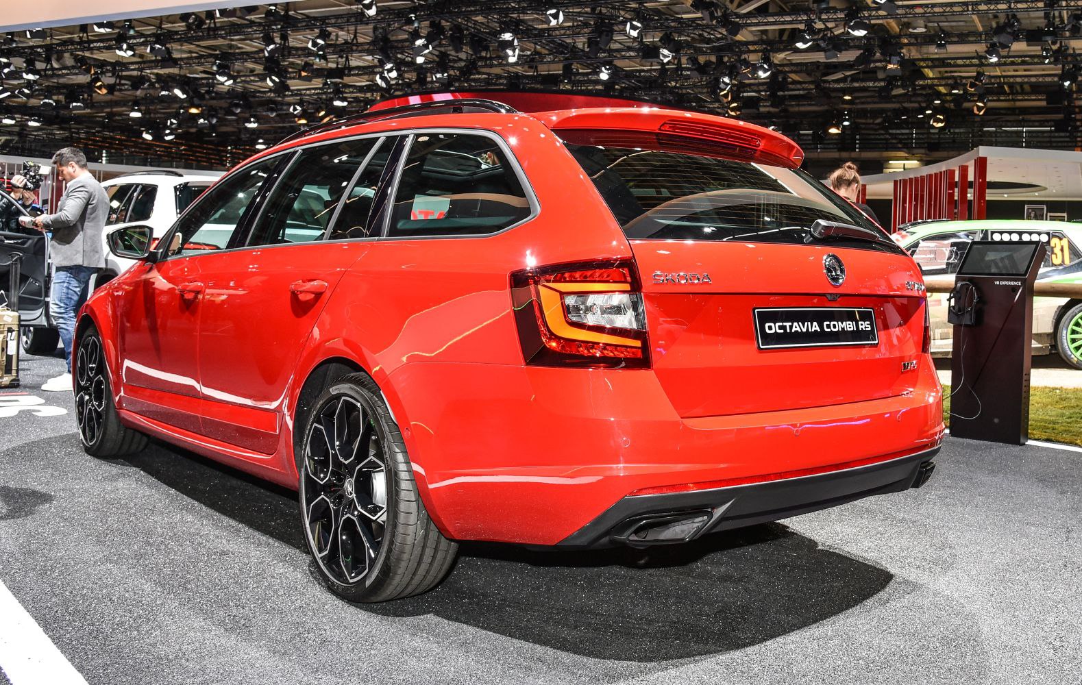 Red sports station wagon with black alloy wheels and tinted windows