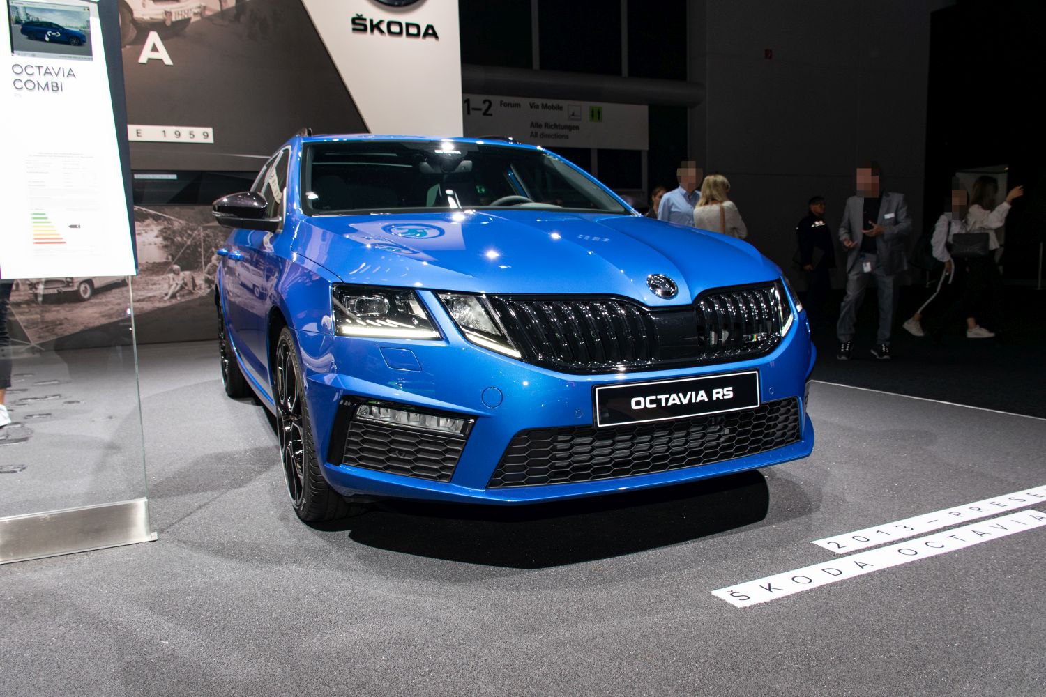 Blue car front with sporty grille and LED headlights