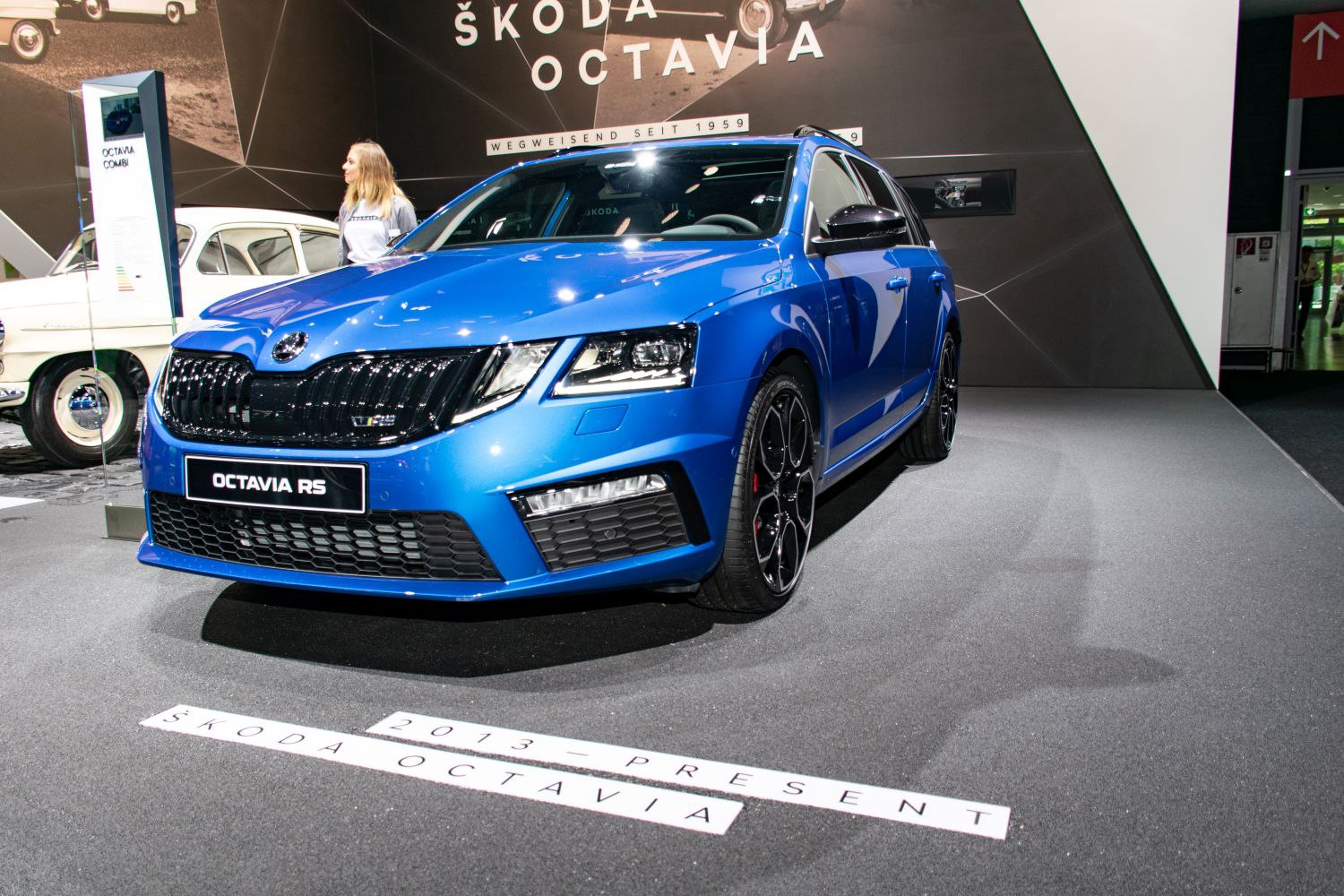 Blue sporty wagon with black grille and alloy wheels