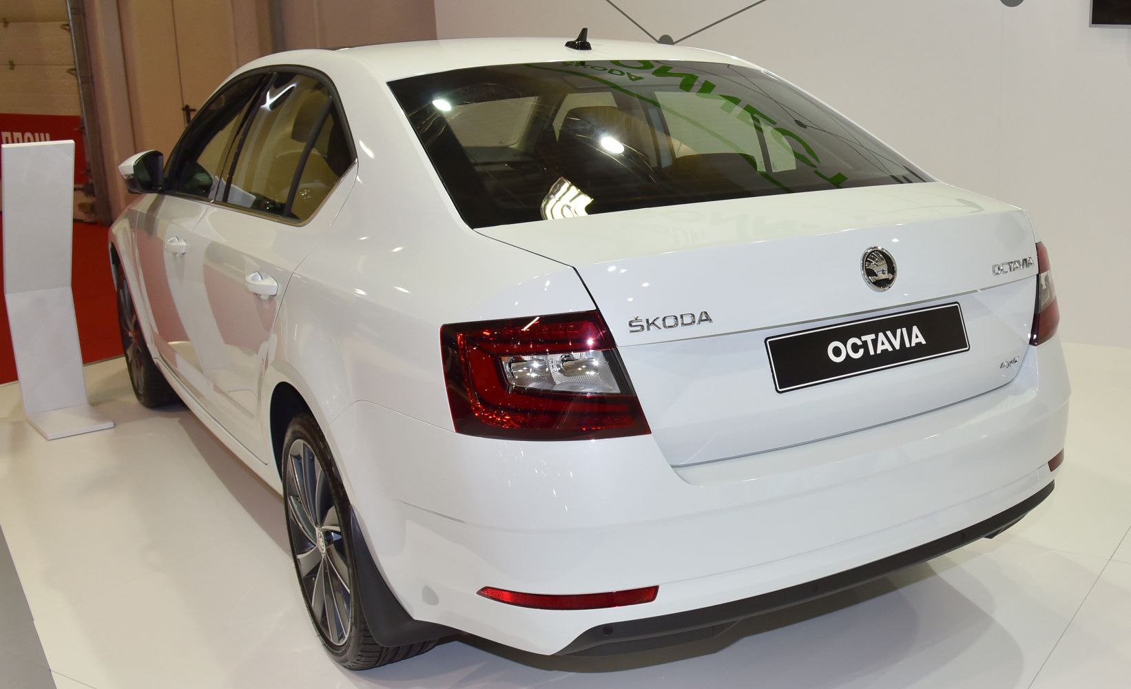 Rear view of sedan with LED tail lights and shark fin antenna