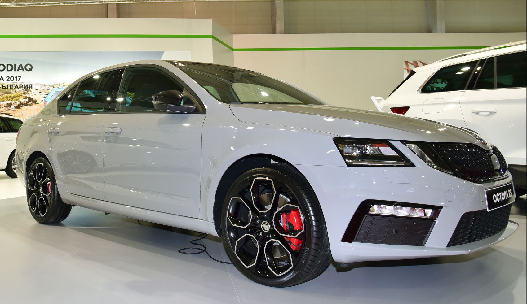 Aerodynamic body with LED headlights and black multi-spoke alloy wheels featuring red brake calipers