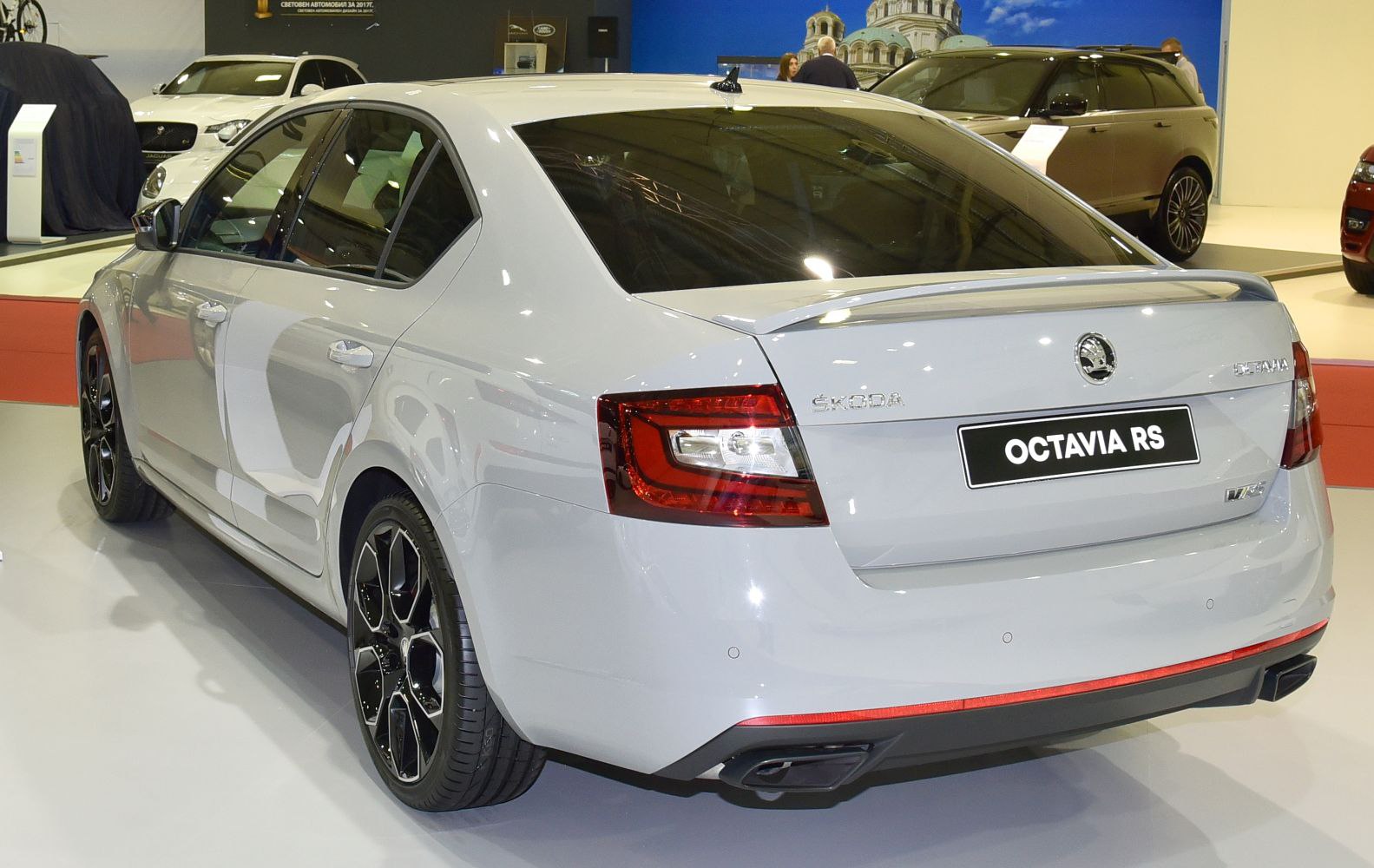 Rear view of sporty sedan with distinctive taillights and alloy wheels