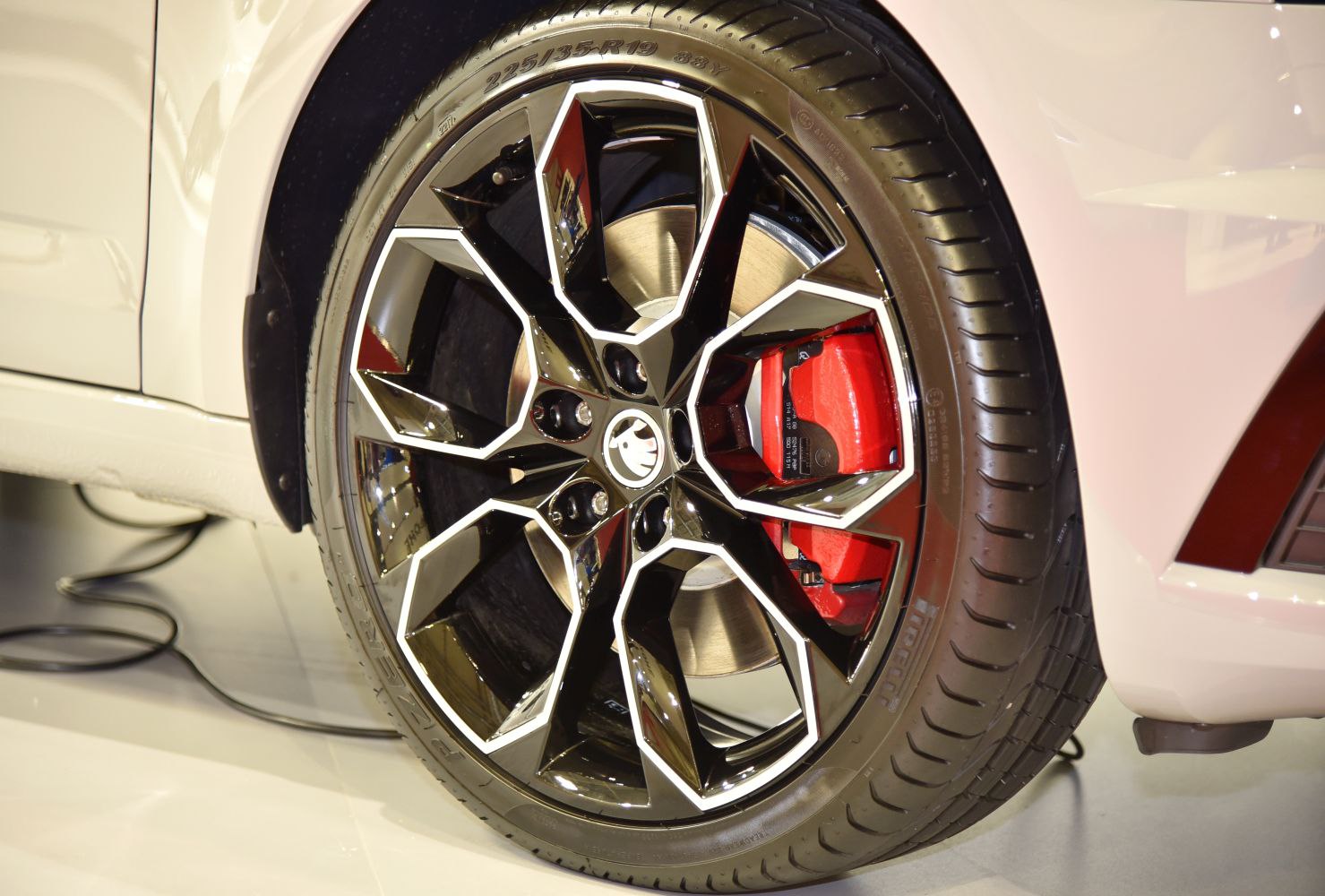 Black and silver alloy wheel with red brake caliper