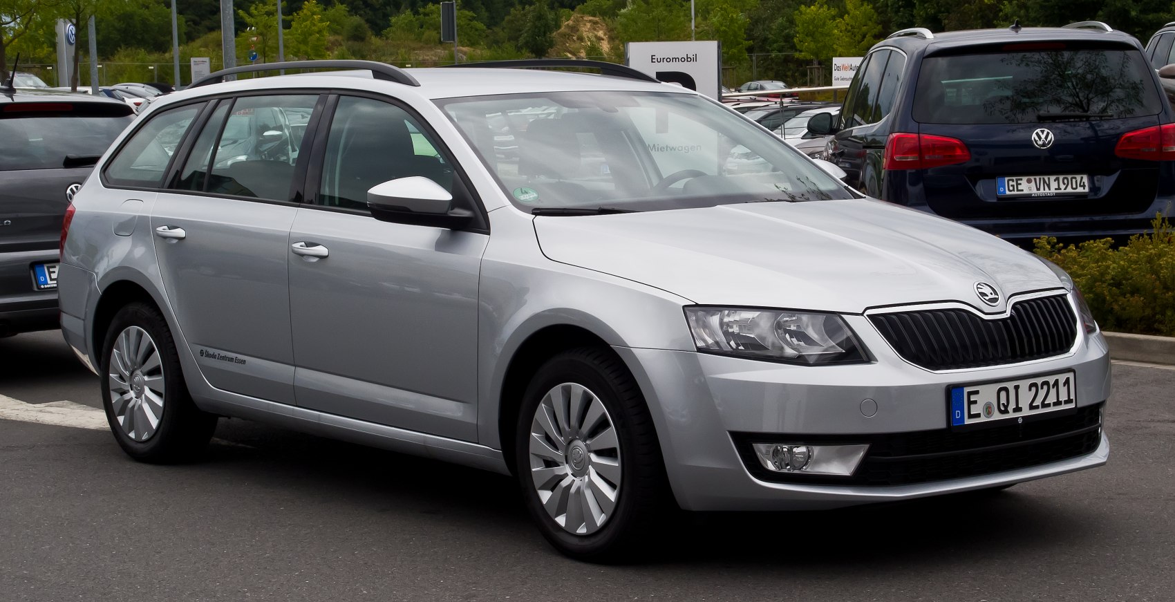 Silver station wagon with roof rails and sharp front headlights