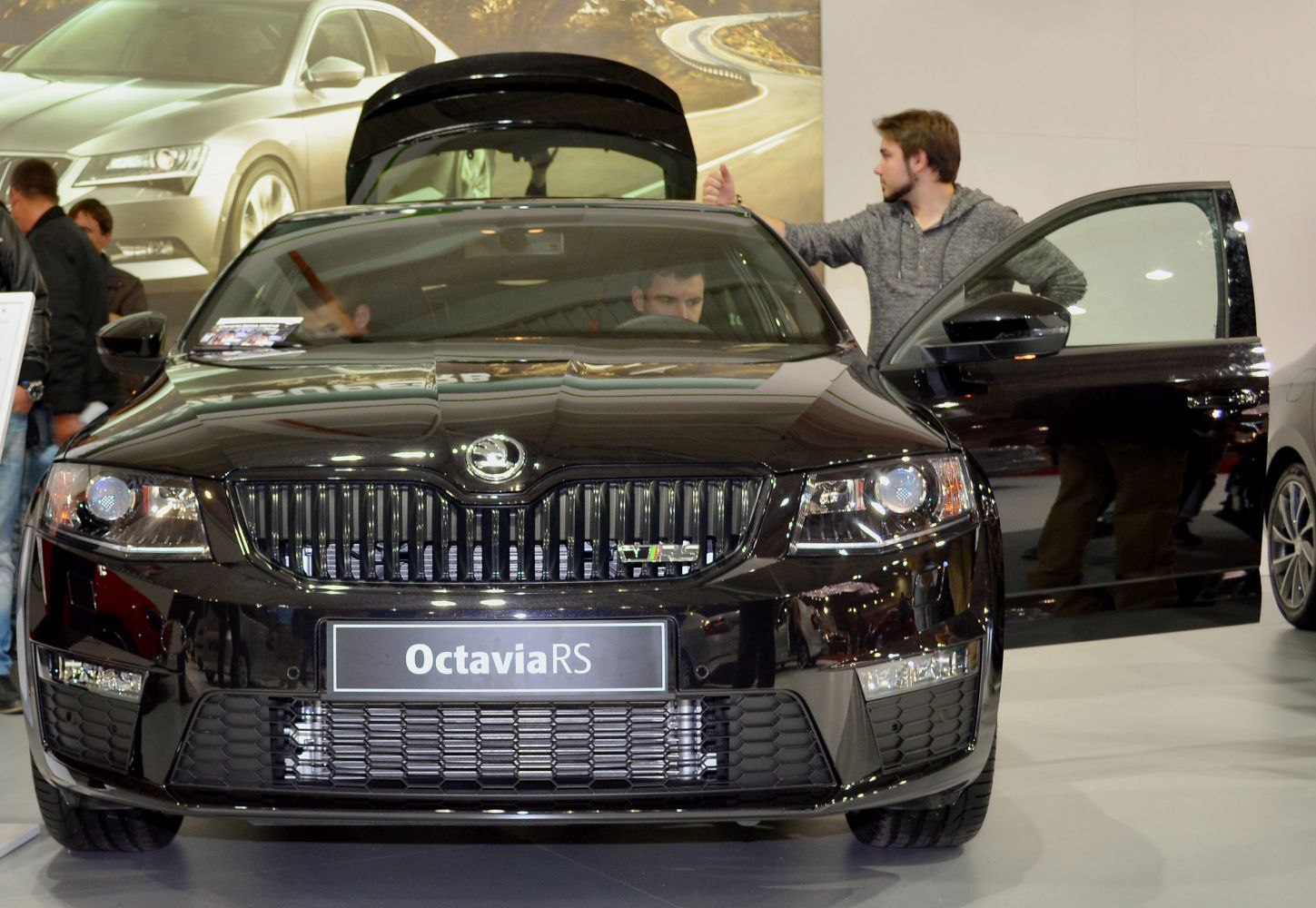 Front view of Octavia III RS with open doors and prominent grille