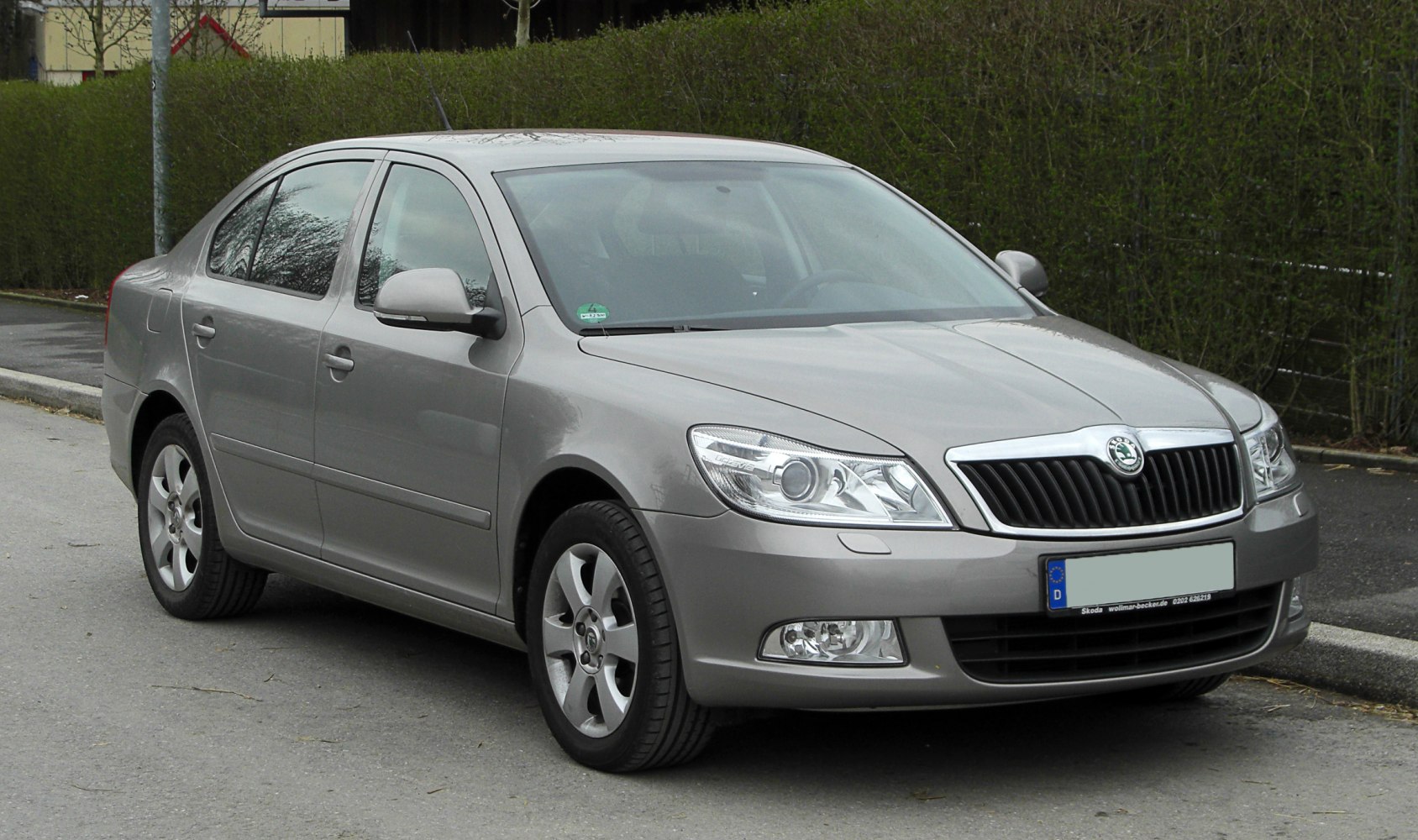 Front exterior with updated headlights and grille of mid-size sedan
