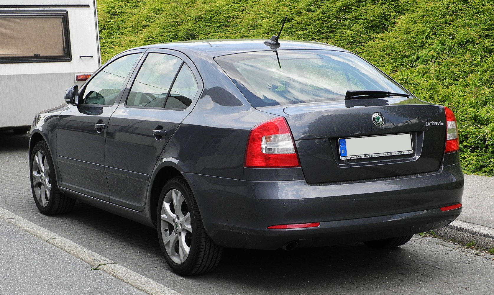 Rear view of a mid-size sedan highlighting tail lights and rear design.