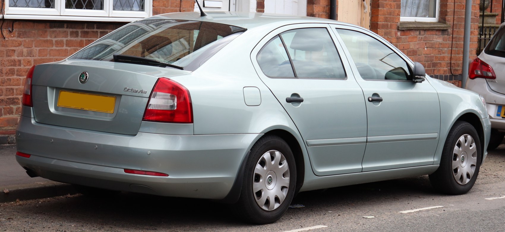 Rear and side view of a sedan with clear taillights and smooth body lines