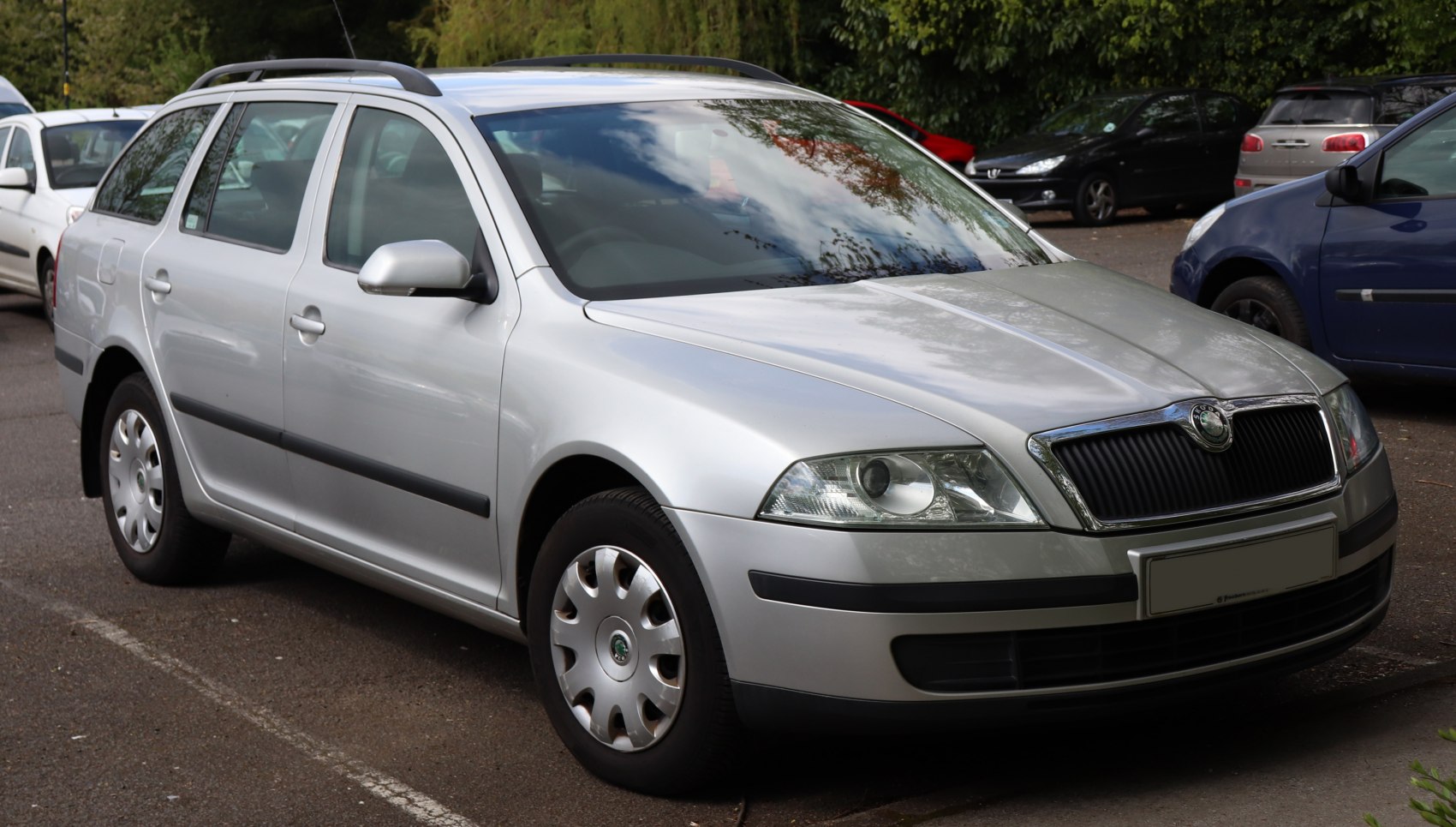 Silver station wagon with roof rails and classic design