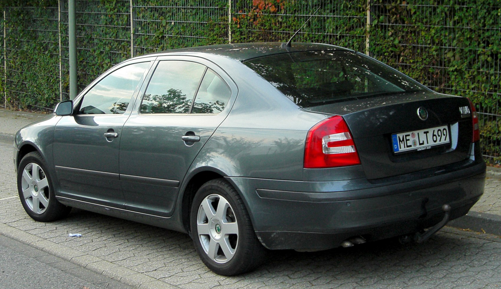 Rear side view of a sedan with alloy wheels