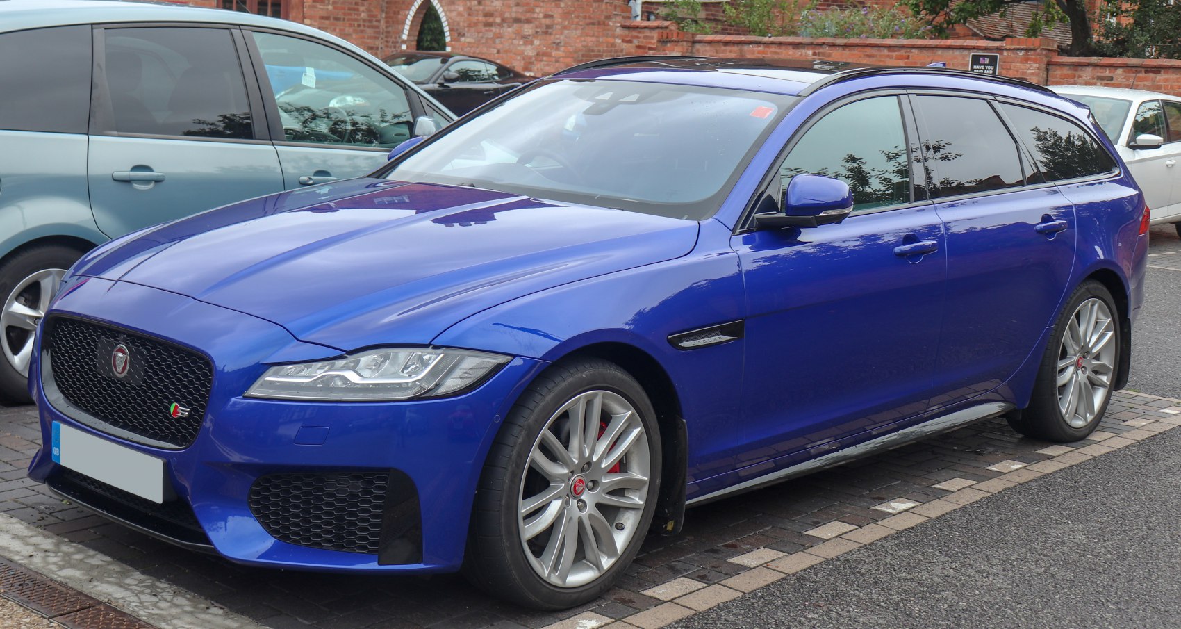 Blue wagon with aggressive front grille and sleek side profile