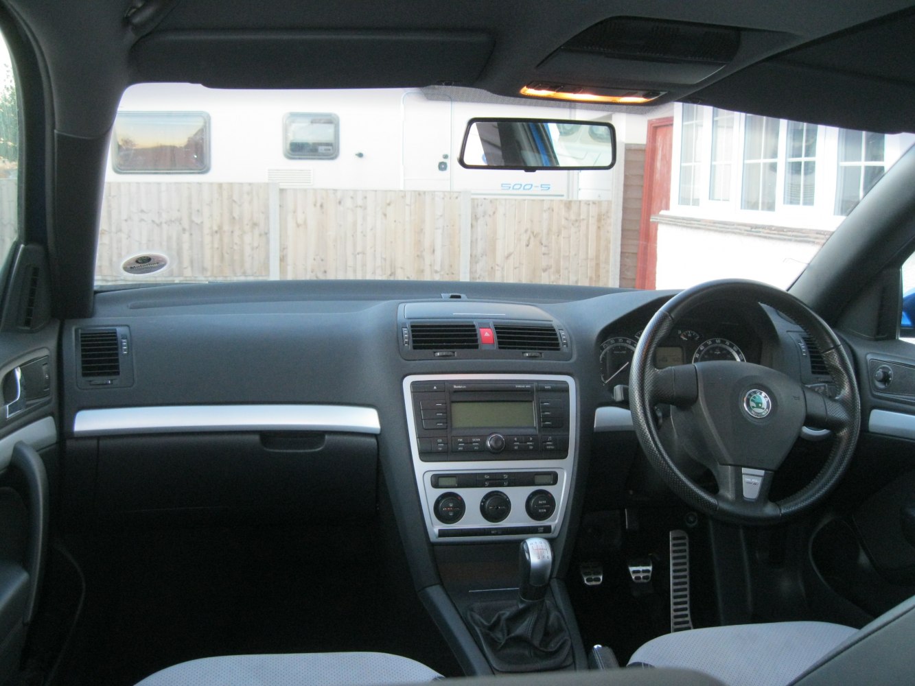 Interior dashboard and steering wheel with manual gearshift
