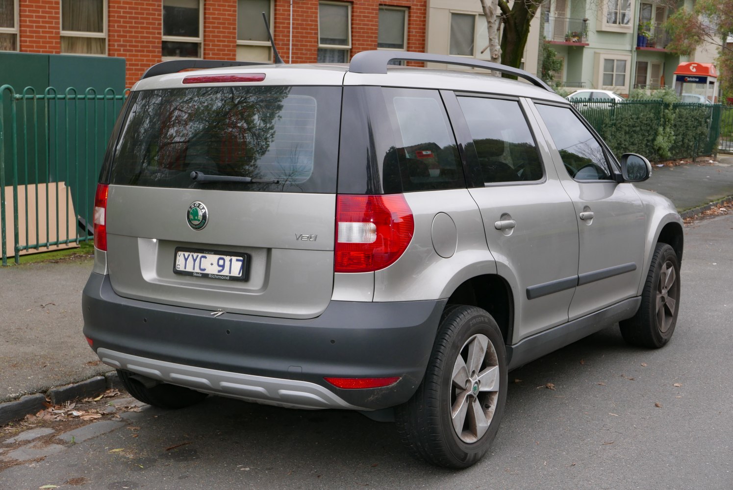 Rear and side view of SUV with distinctive rear lights and roof rails