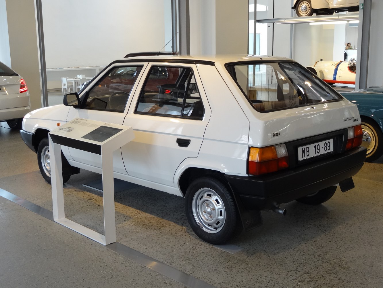 Rear and side view of a classic hatchback with steel wheels