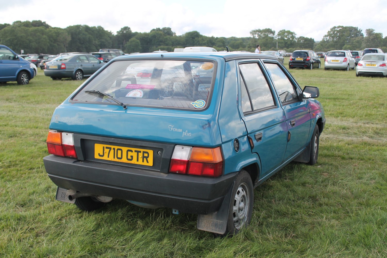 Compact hatchback rear with distinctive taillights and large rear window