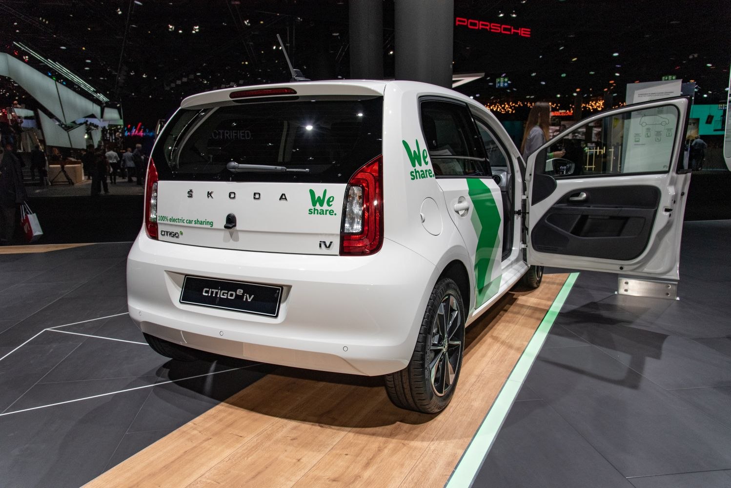 Rear view of Skoda Citigo 5-door with open door and electric sharing decals