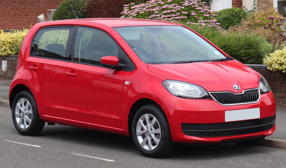 Red 5-door hatchback with facelifted grille and headlights