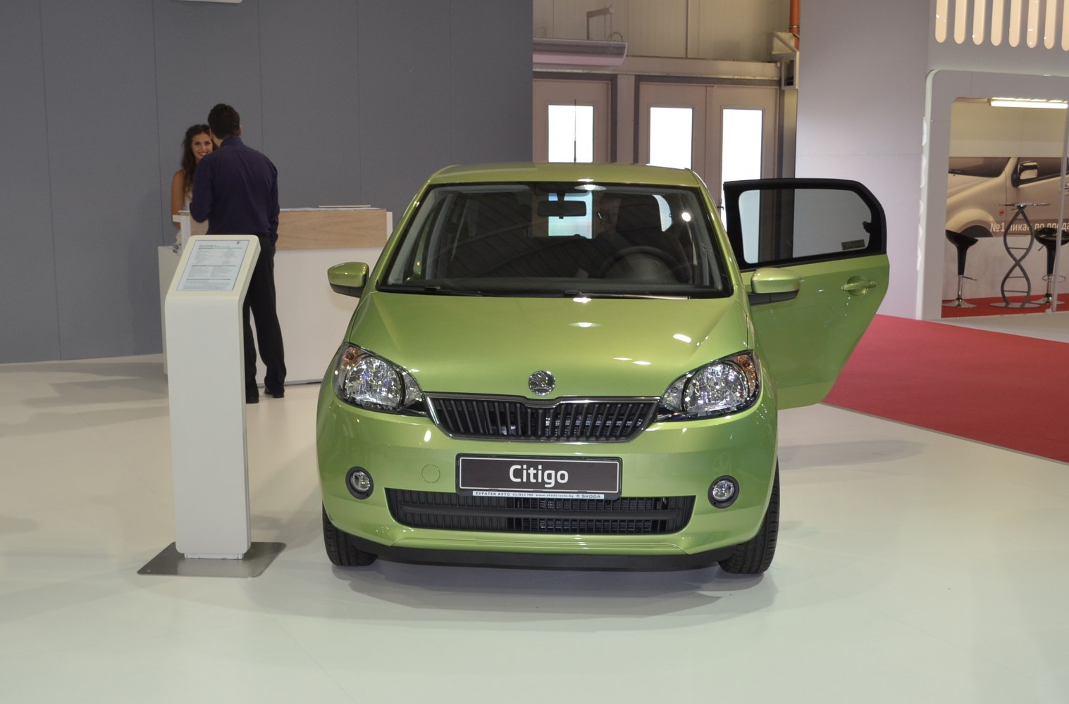 Front view of compact hatchback with open door
