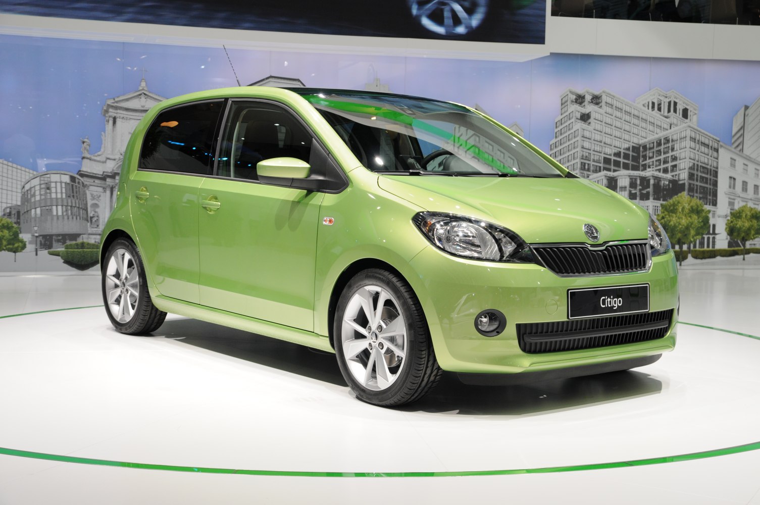 Green 5-door compact hatchback with alloy wheels, front 3/4 angle