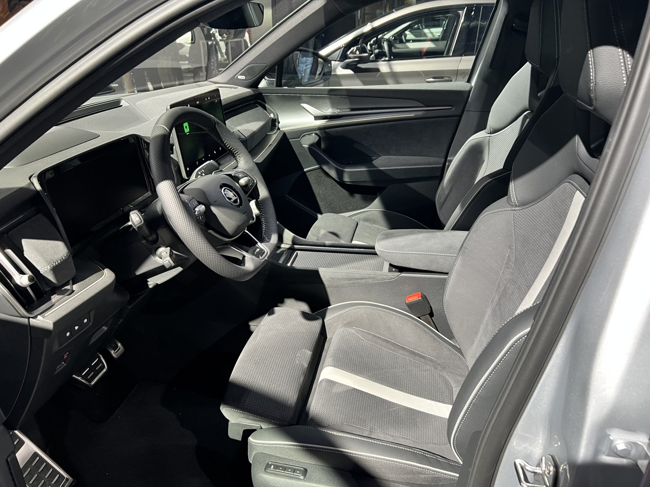 Digital instrument cluster and ergonomic front seats with multifunction steering wheel