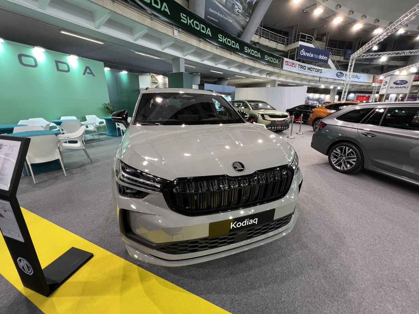 Front view with black grille and LED headlights in showroom.