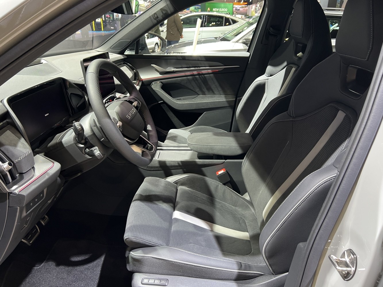 Modern dashboard with digital displays and sporty front seats