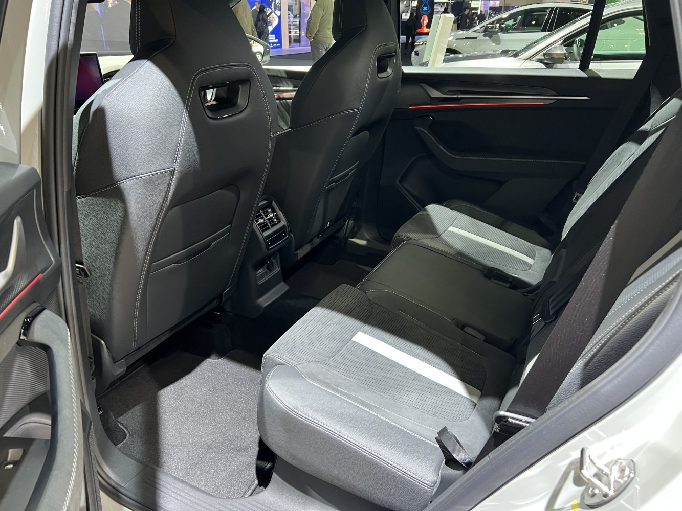 Spacious rear seating with modern upholstery and rear air conditioning vents.