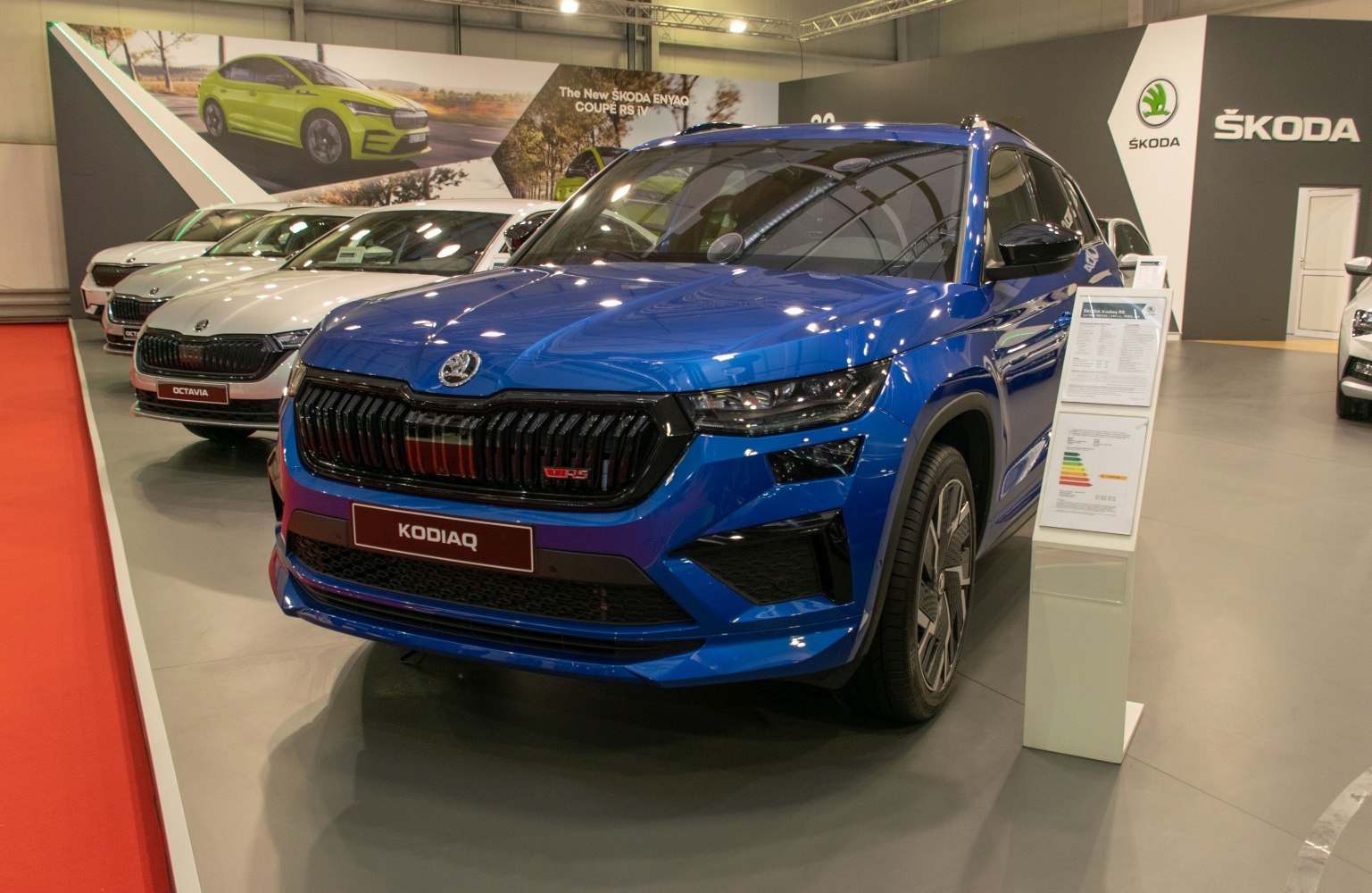 Blue SUV with bold grille and sleek headlights front view