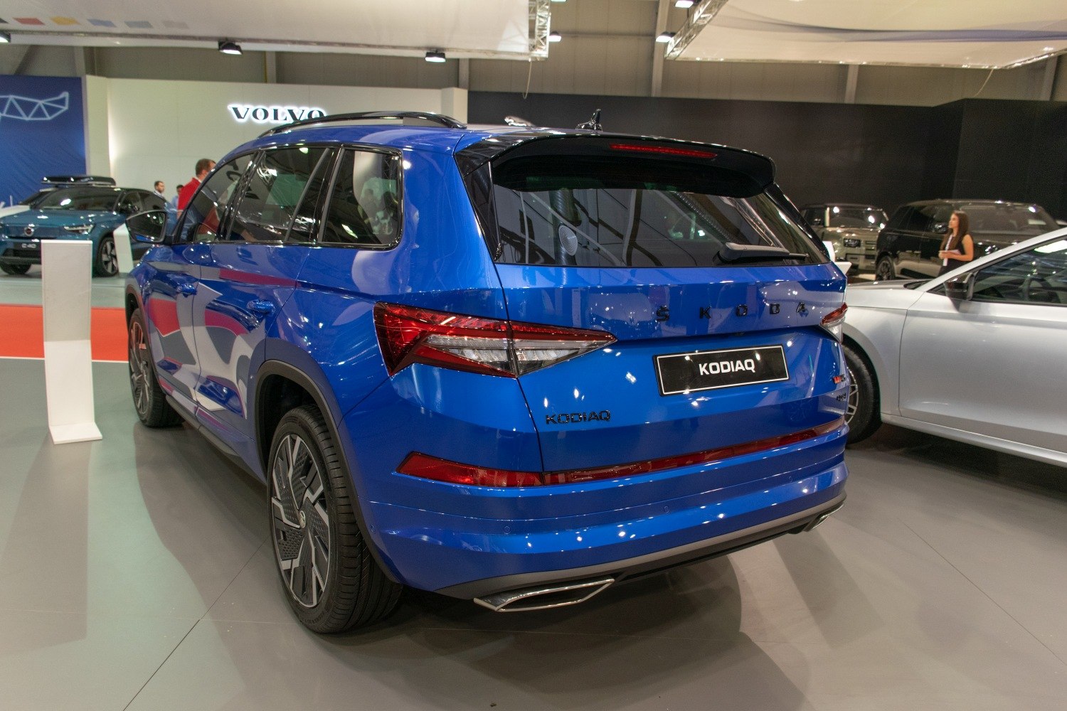 Sharp tail lights and blue SUV side and rear view