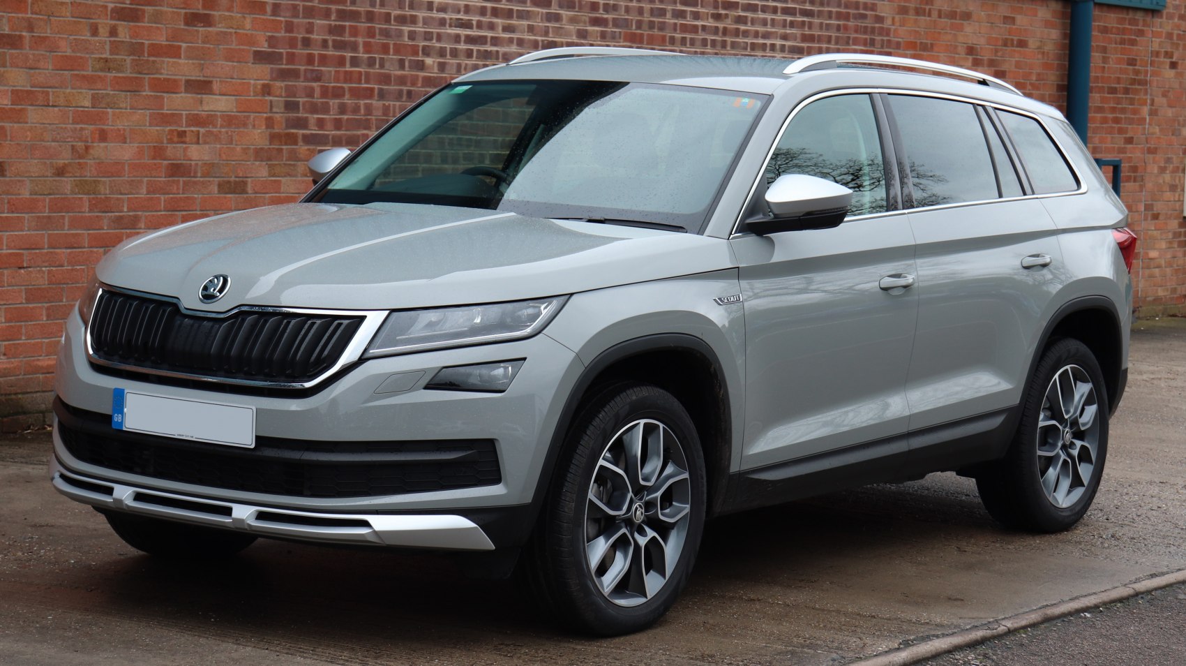 Front side view of SUV with distinctive grille and headlights