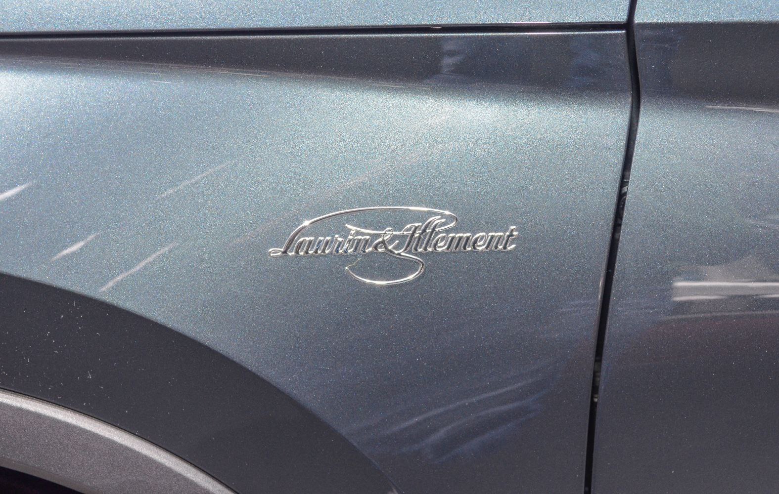 Close-up of Laurin & Klement emblem on vehicle side panel