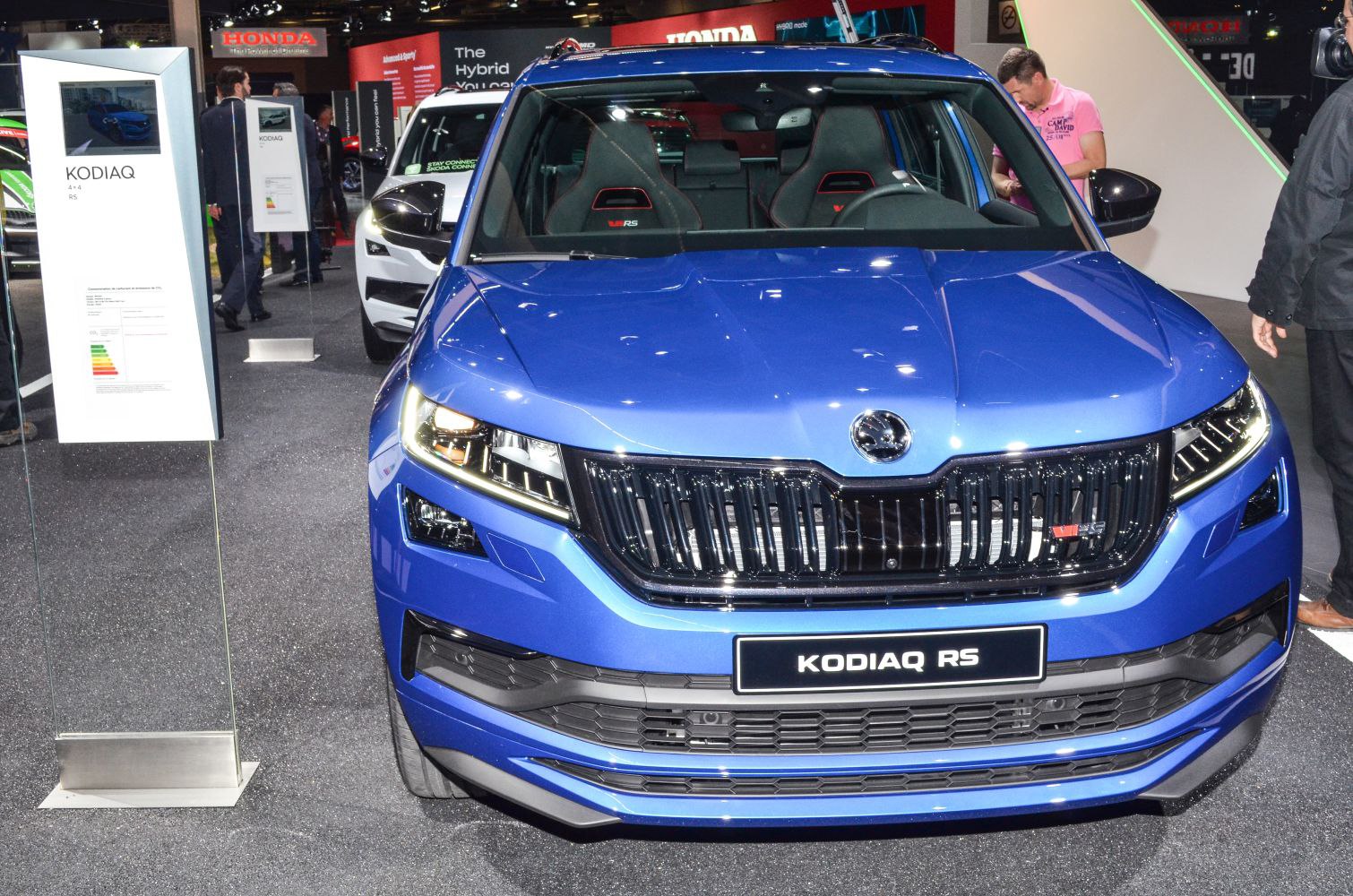 Front view with black grille, LED headlights, and sporty seats