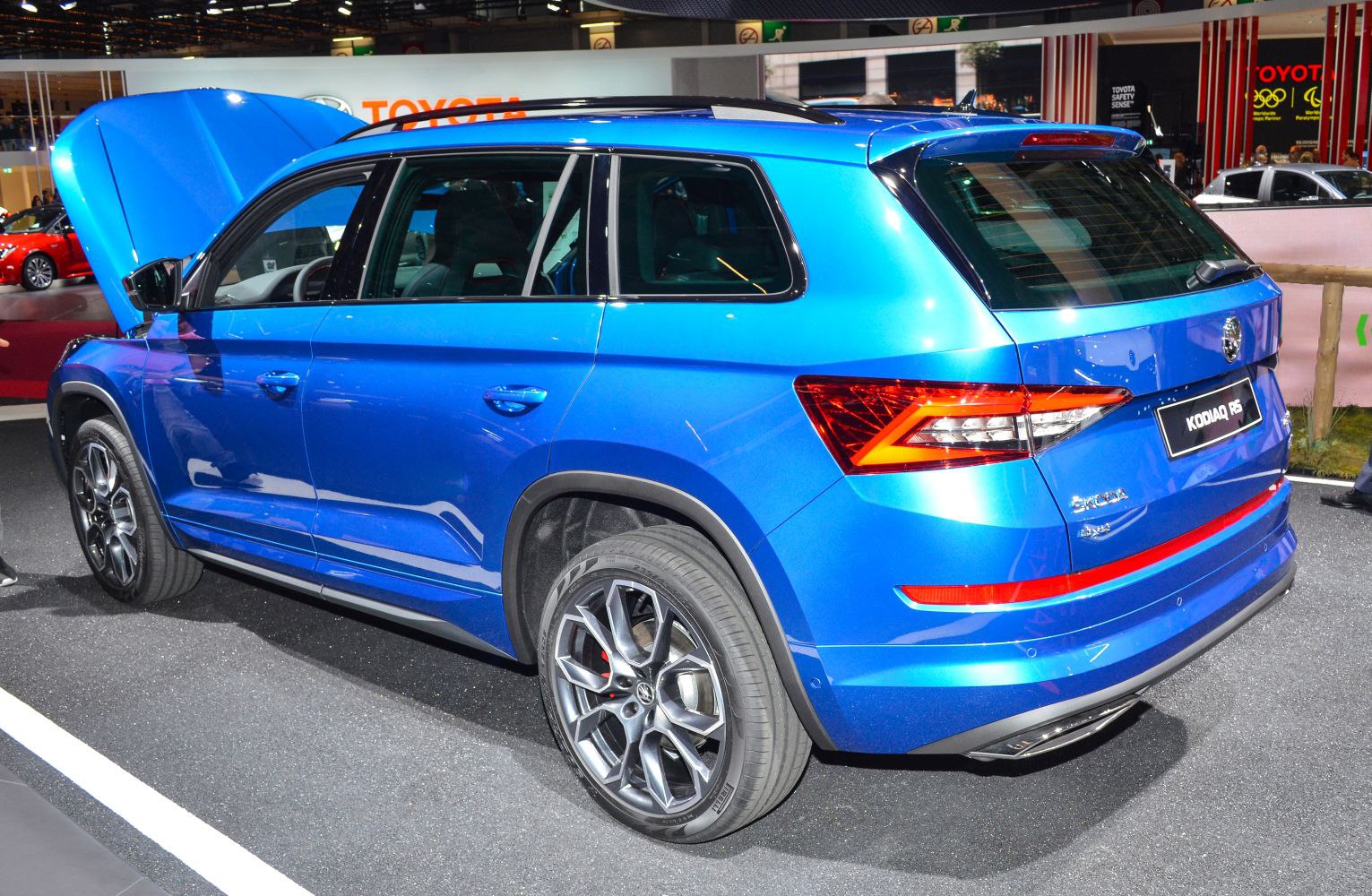 Rear side of blue SUV with alloy wheels and angular taillights