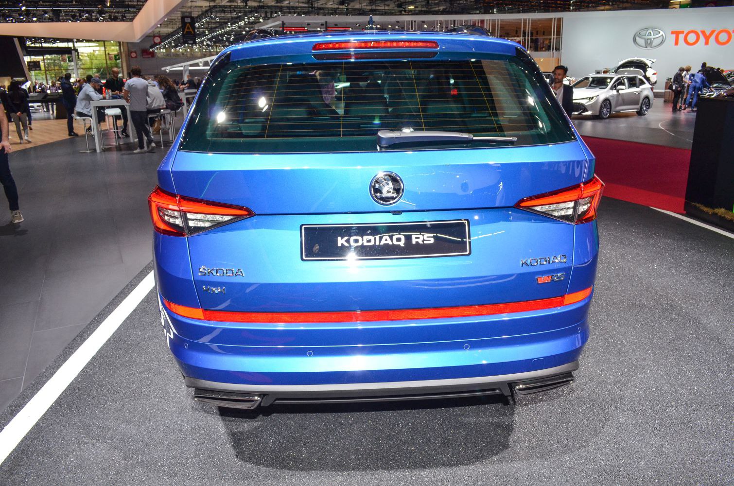 Rear view of blue SUV with LED tail lights and dual exhaust outlets