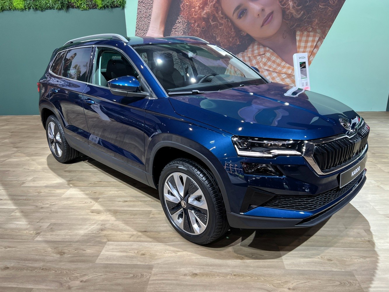 Front and side exterior view with LED headlights and modern grille.