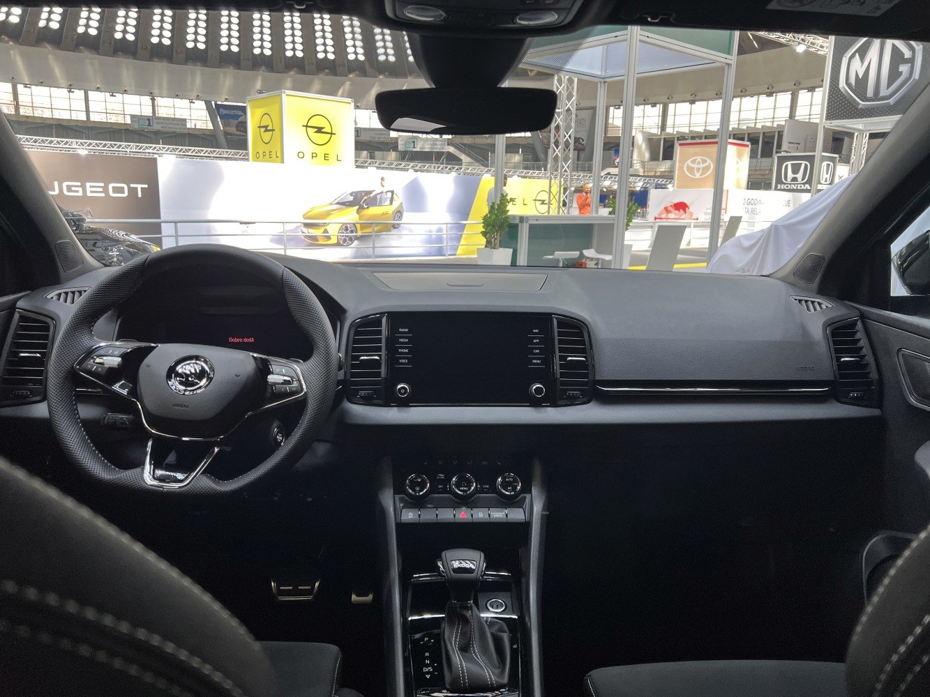 Dashboard with touchscreen and multifunction steering wheel with gear shift