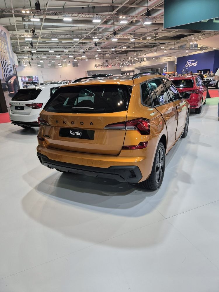 Rear view of orange SUV with modern taillights and sporty design
