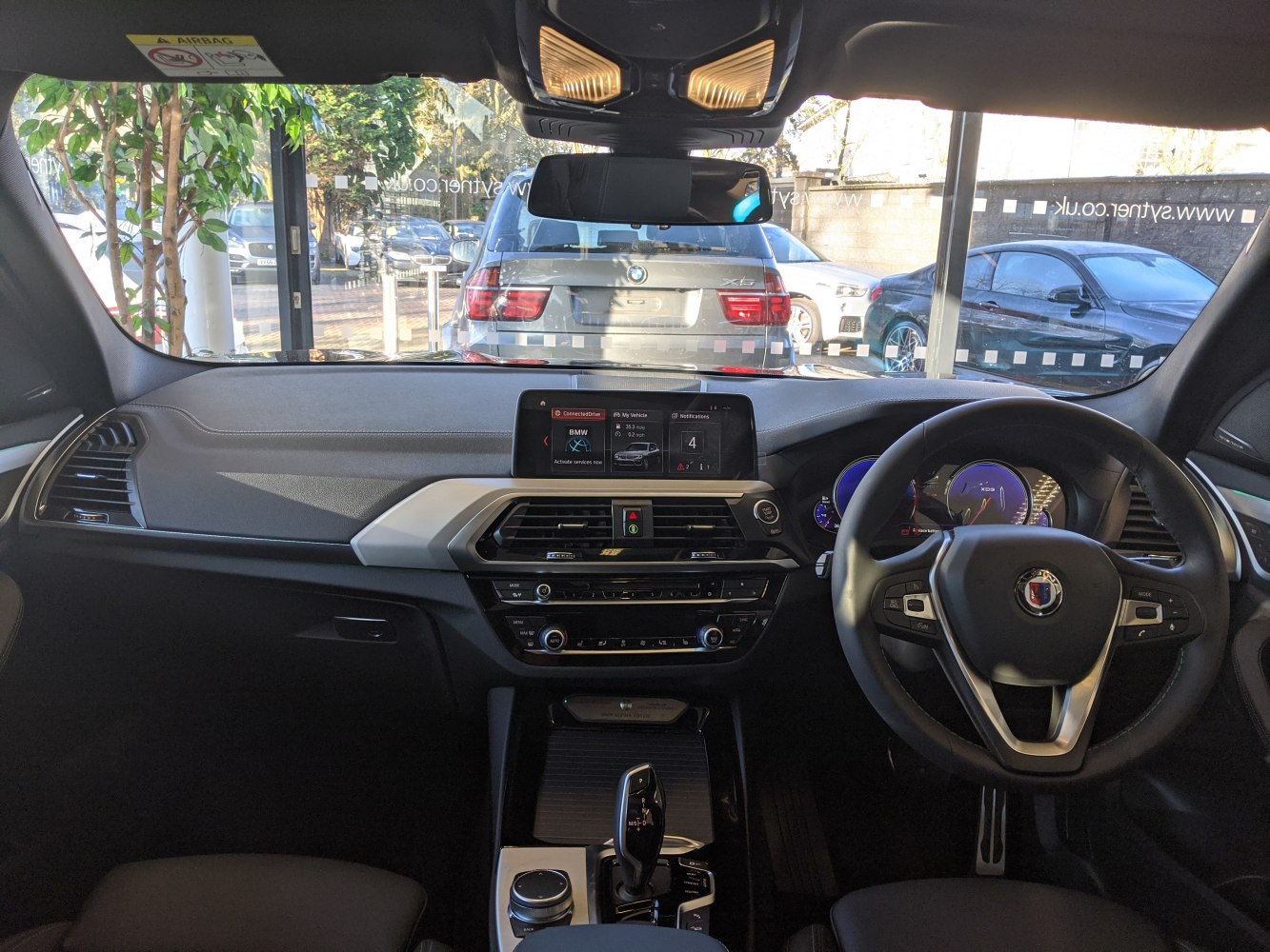 Dashboard, steering wheel, and infotainment console view