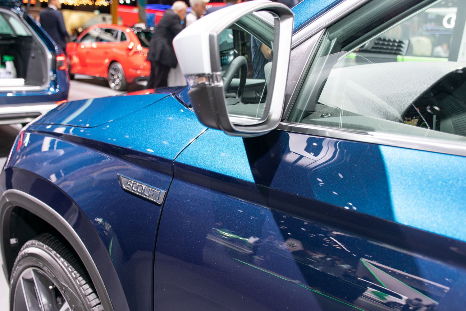 Side view mirror and Scout badge on blue SUV fender