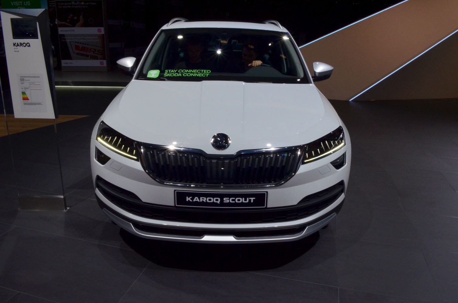 Front view of a white SUV with LED daytime running lights and distinctive grille.