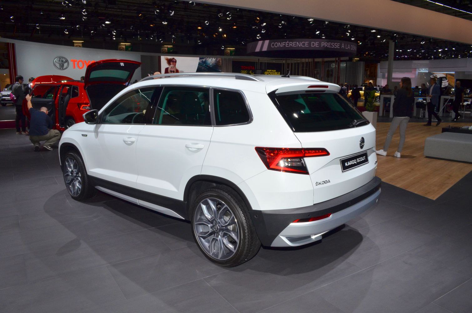 Side rear view of white SUV with alloy wheels and sporty rear design