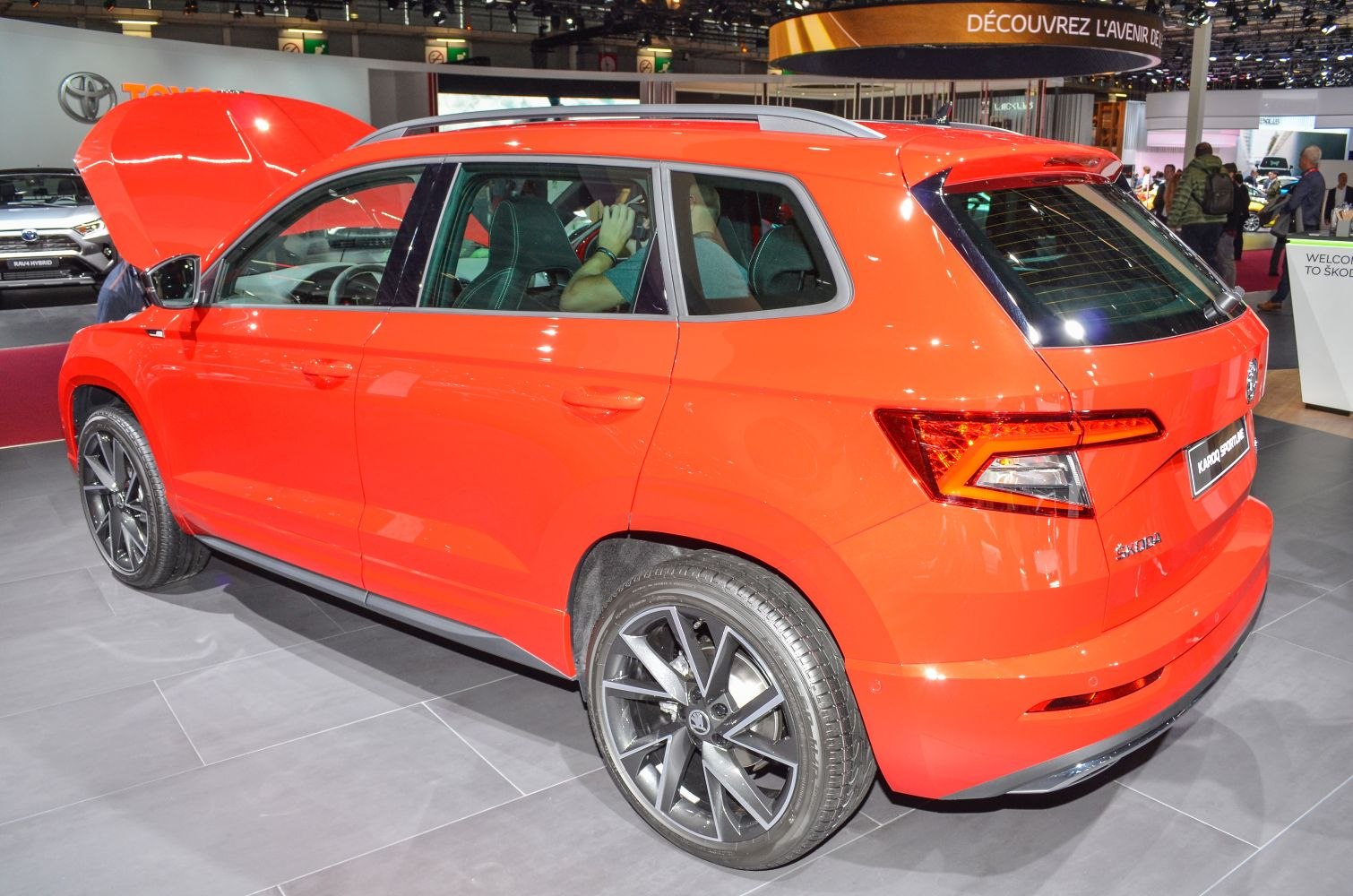 Red compact SUV rear and side view with alloy wheels and distinct taillights