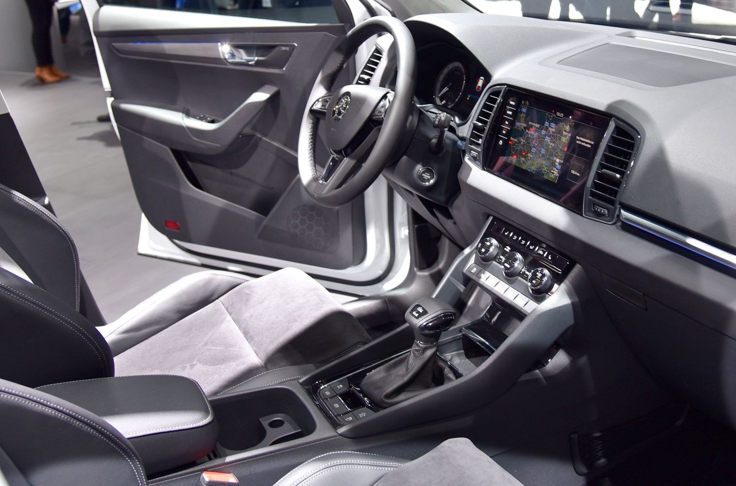 Touchscreen navigation and modern dashboard with gear shift and steering wheel