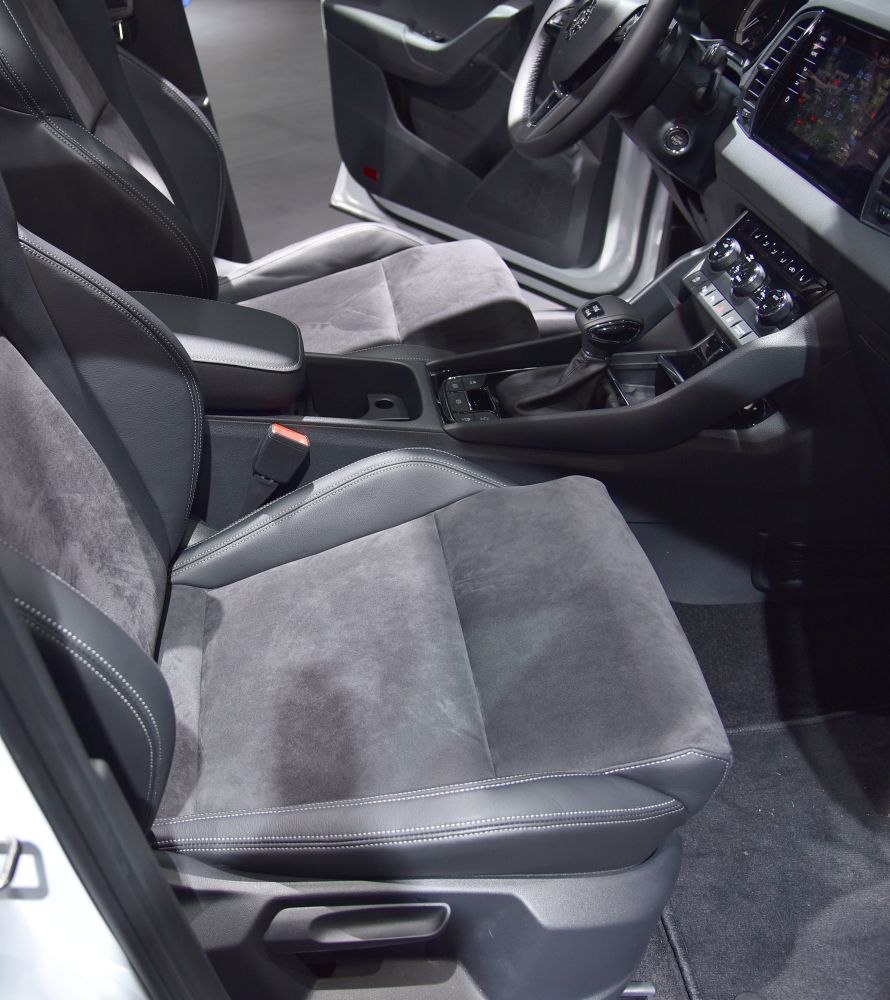 Modern car seats and center console with gear shift and controls