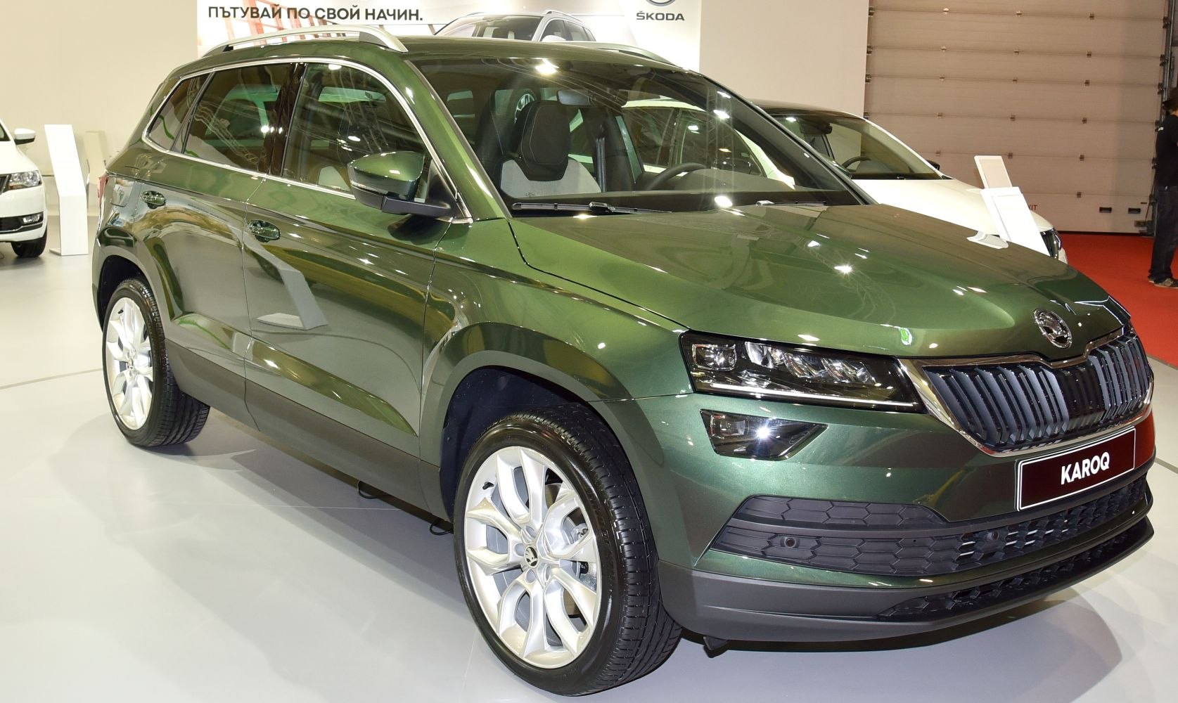 Front angled view showing LED headlights and modern SUV grille