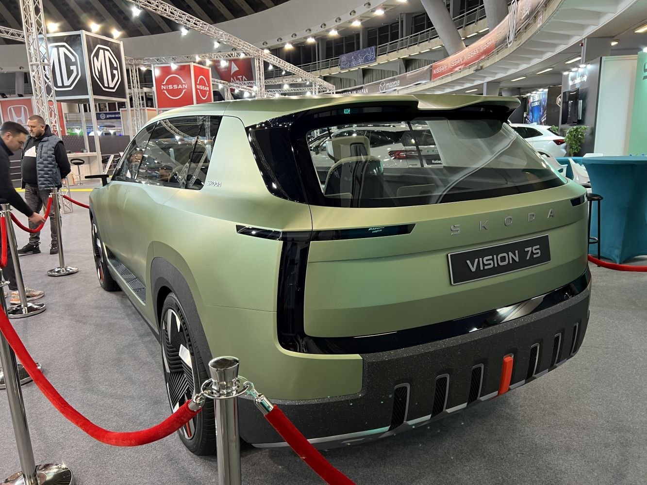 Rear and side view of matte green SUV concept with vertical tail lights
