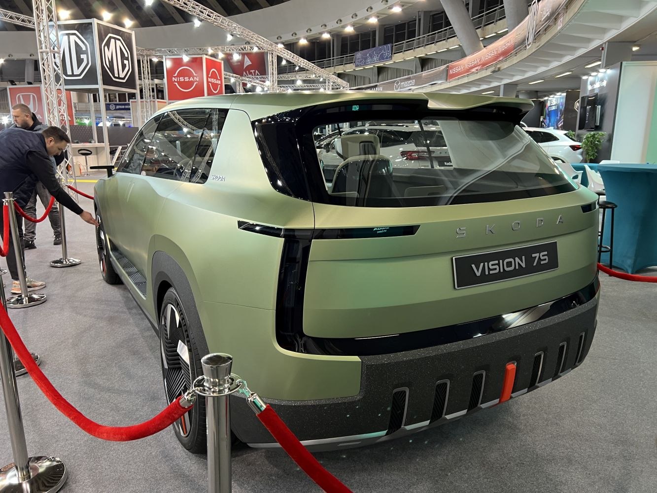 Rear design with futuristic tail lights and matte green finish